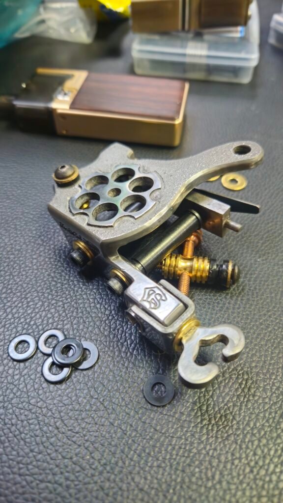 an image of a tattoo machine and its parts.