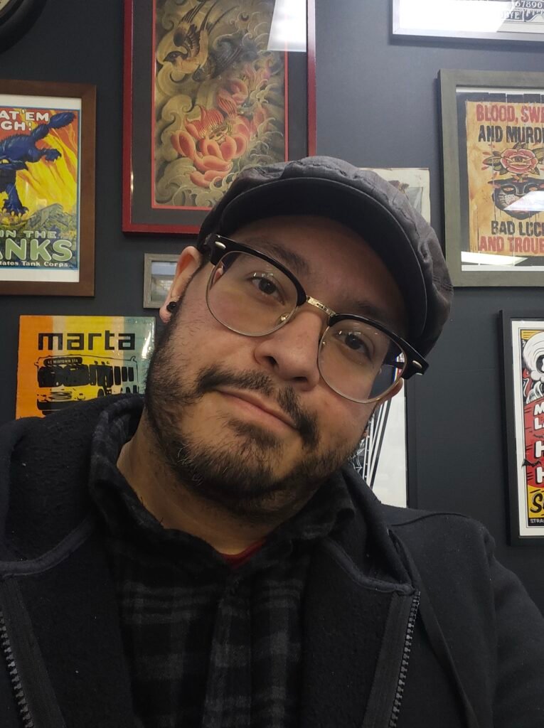 A photograph of Nathan Heinrich the owner and a tattoo artist at Near Me Tattoo in Woodstock Georgia 30189