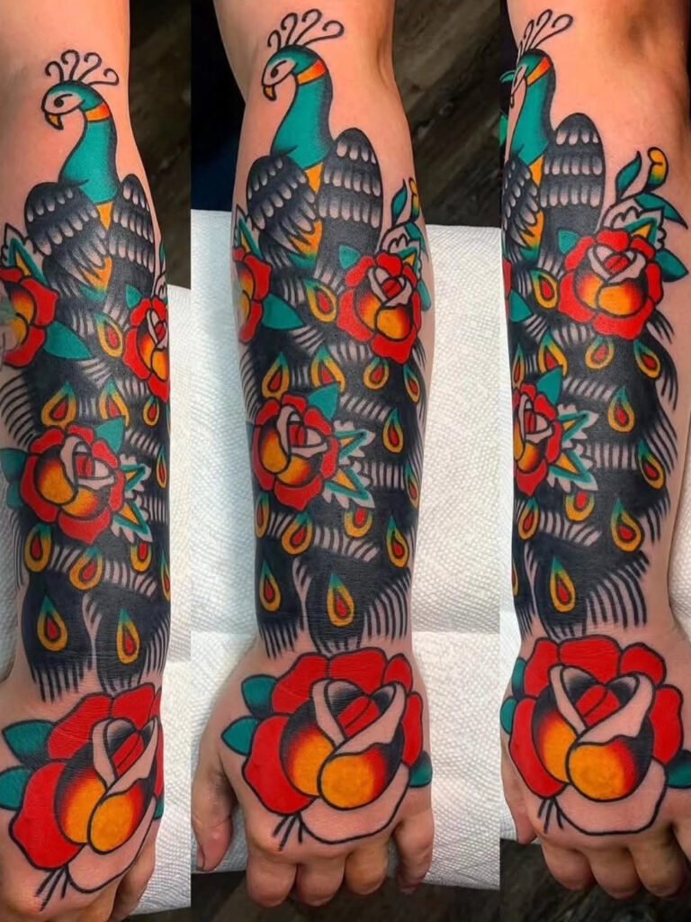 an American traditional tattoo of a peacock half sleeve. The body of the peacock and tail extend the entire forearm and has 3 roses in it. on the hand is one large rose. This tattoo was made by Noah Beach, co owner of Near Me Tattoo at 6721 Bells Ferry Rd Ste D110 Woodstock, Ga. 30189
